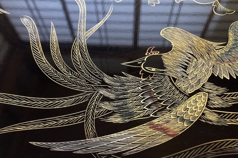 Traditional Japanese maki-e lacquerware depicting a phoenix motif