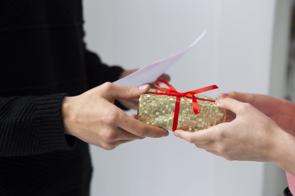 Person presenting a gift