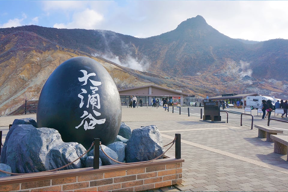 Hakone Owakudani volcanic valley with black egg monument on a Mt. Fuji Hakone day trip from Tokyo