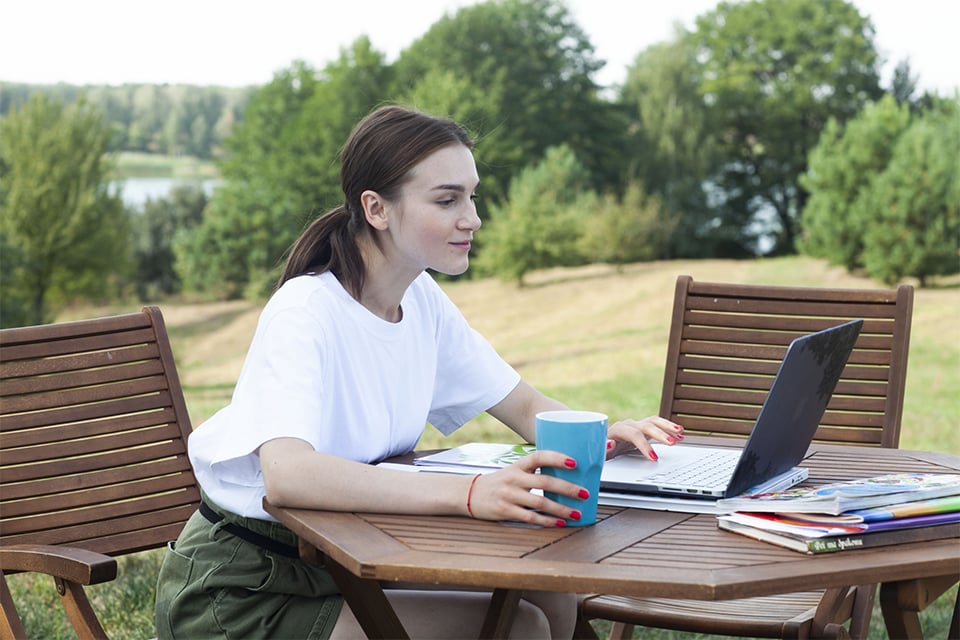 Business professional researching event coordinator companies online