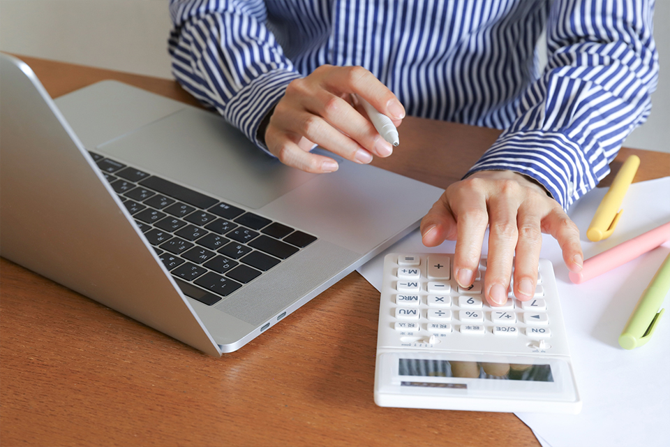 Business event planner reviewing event budget and pricing with a corporate client
