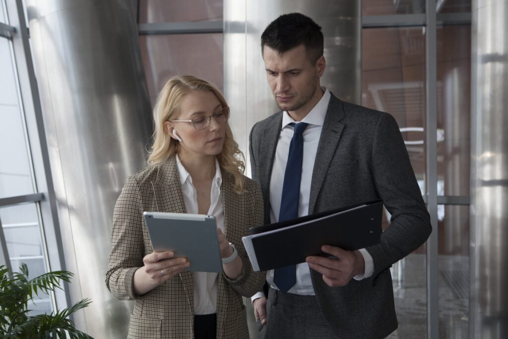 Business professionals discussing event planning with a destination management company
