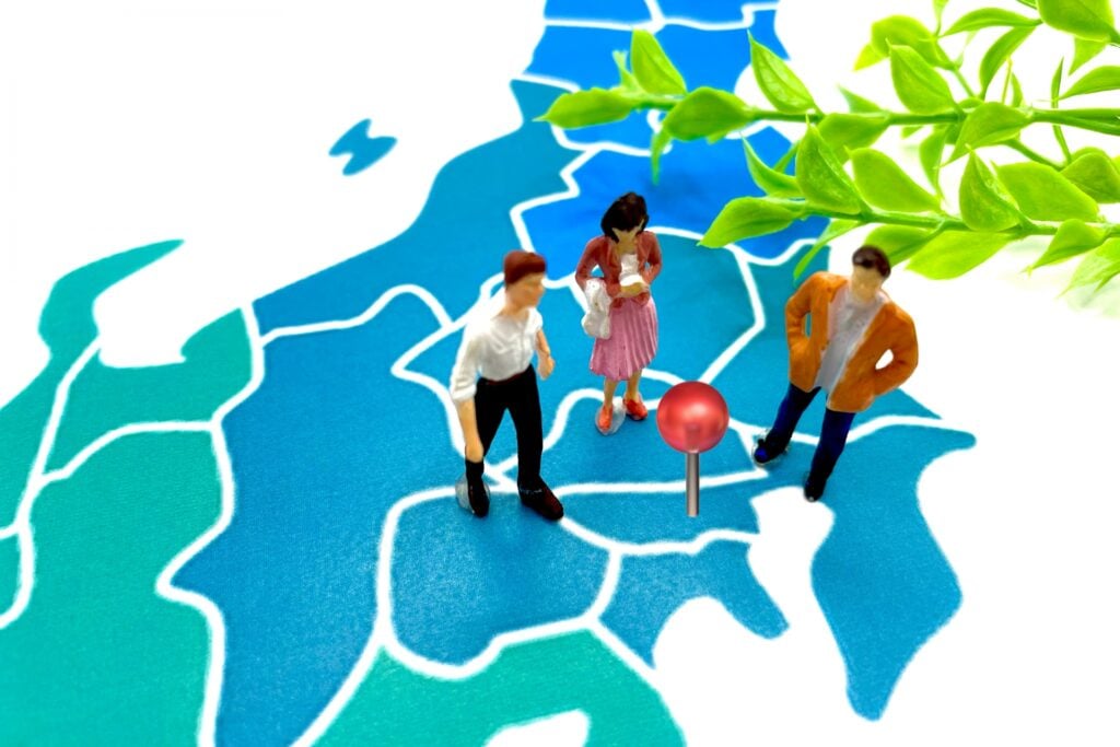 People choosing a destination on a map of Japan for business events