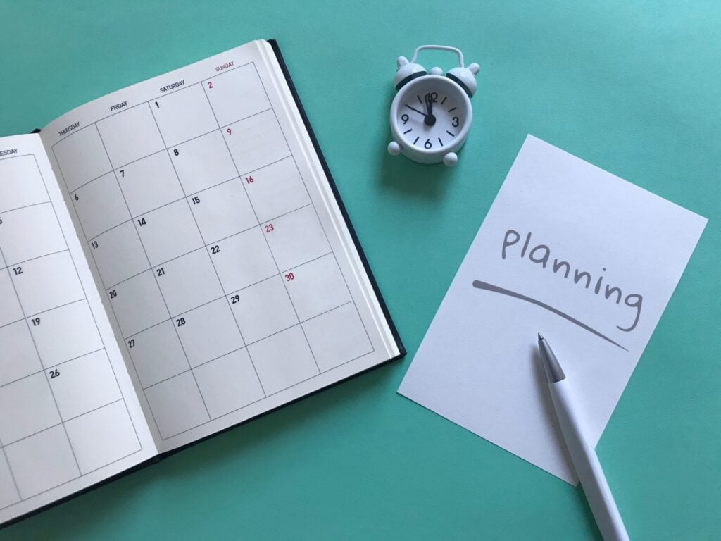 Calendar and planning notes for organizing a business event in Japan