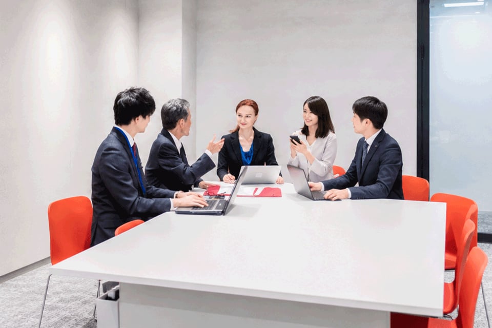Business professionals attending a corporate meeting at a hotel venue in Tokyo