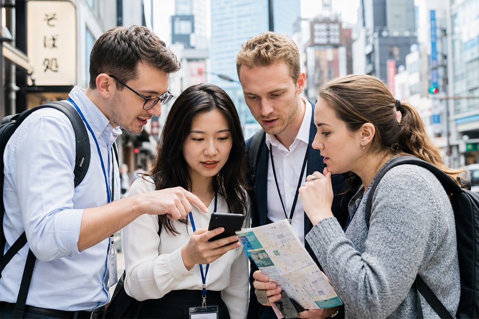 International corporate team participating in a city-wide team building challenge in Tokyo